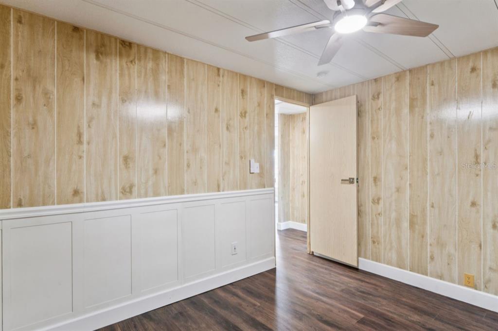 15071 Rialto Avenue Brooksville, FL 34613 - Photo 19 of 41 a view of an empty room with wooden floor