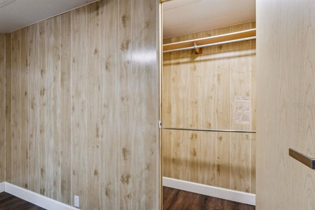 15071 Rialto Avenue Brooksville, FL 34613 - Photo 21 of 41 a bathroom with a glass shower door