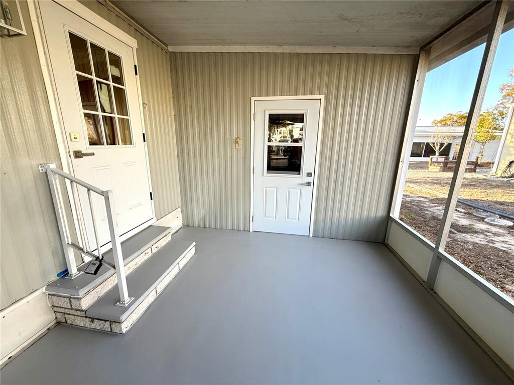15071 Rialto Avenue Brooksville, FL 34613 - Photo 24 of 41 a view of a hallway with windows