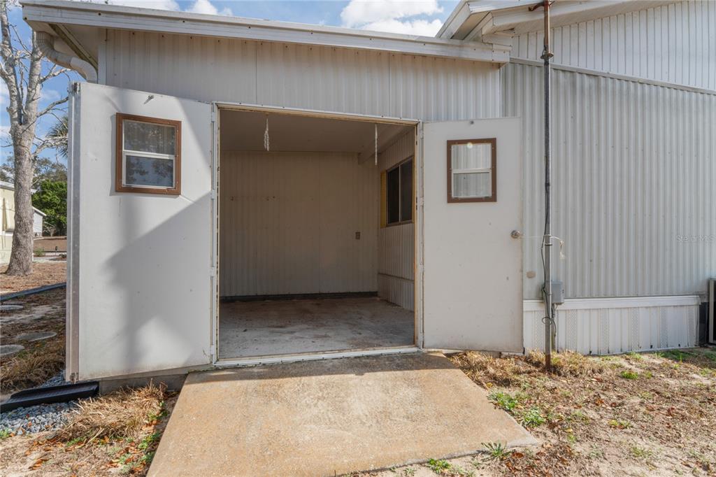 15071 Rialto Avenue Brooksville, FL 34613 - Photo 28 of 41 a view of a house with a wooden door