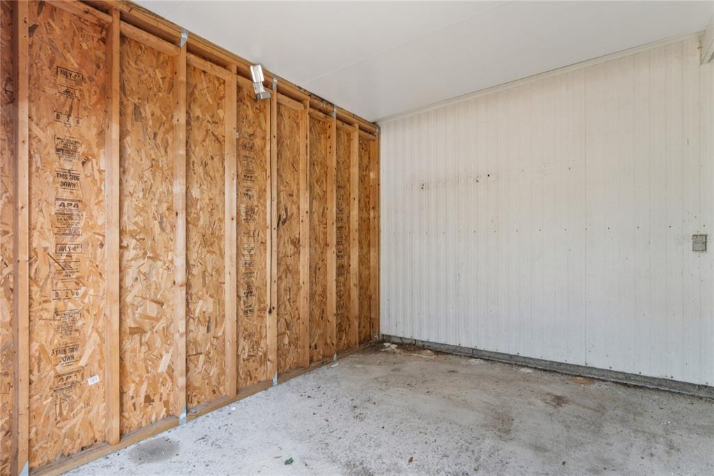 15071 Rialto Avenue Brooksville, FL 34613 - Photo 29 of 41 a view of a garage with curtain