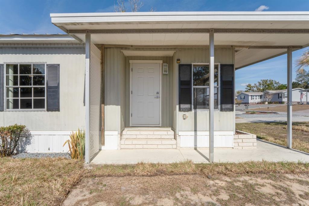15071 Rialto Avenue Brooksville, FL 34613 - Photo 3 of 41 a view of entrance gate of a house