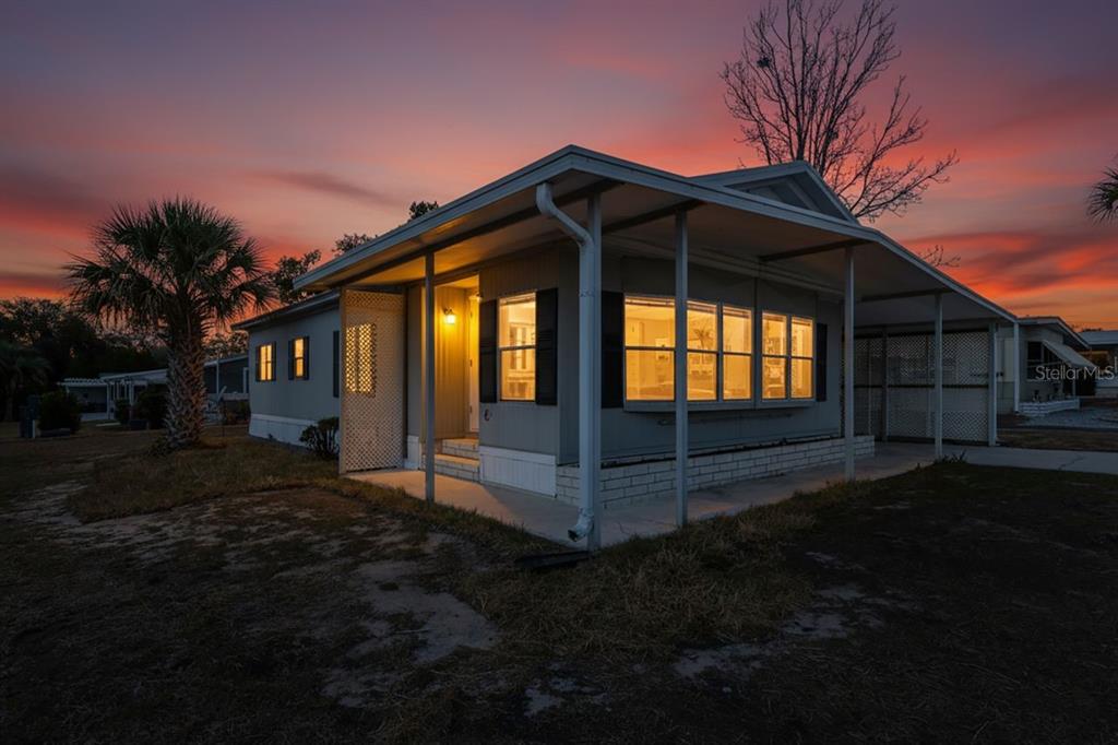 15071 Rialto Avenue Brooksville, FL 34613 - Photo 41 of 41 a front view of a house with a garden