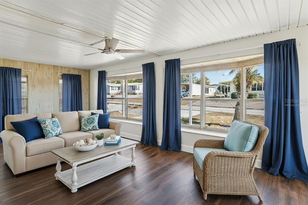 15071 Rialto Avenue Brooksville, FL 34613 - Photo 8 of 41 a living room with furniture and a large window