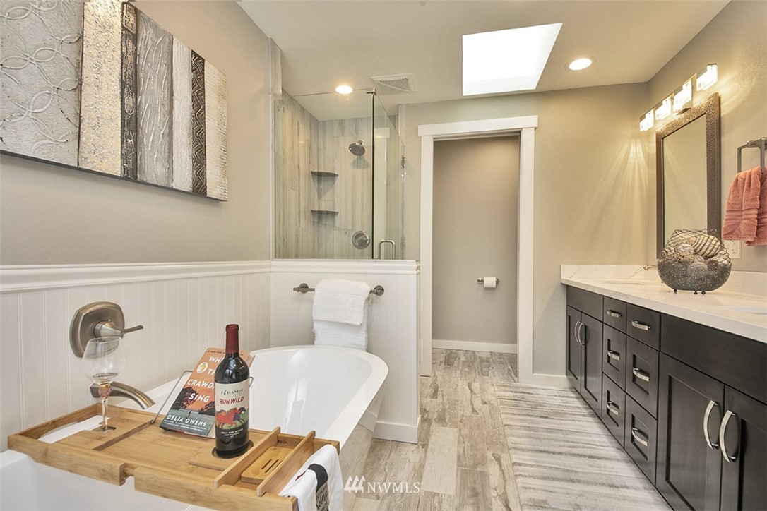 971 Sandy Point Road Langley, WA 98260 - Photo 15 of 25 a bathroom with a sink double vanity and a mirror