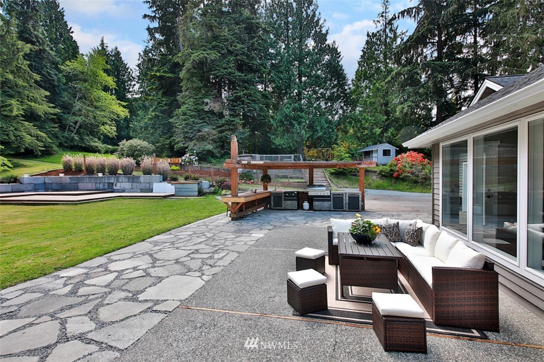 971 Sandy Point Road Langley, WA 98260 - Photo 18 of 25 a view of backyard with outdoor seating and green space
