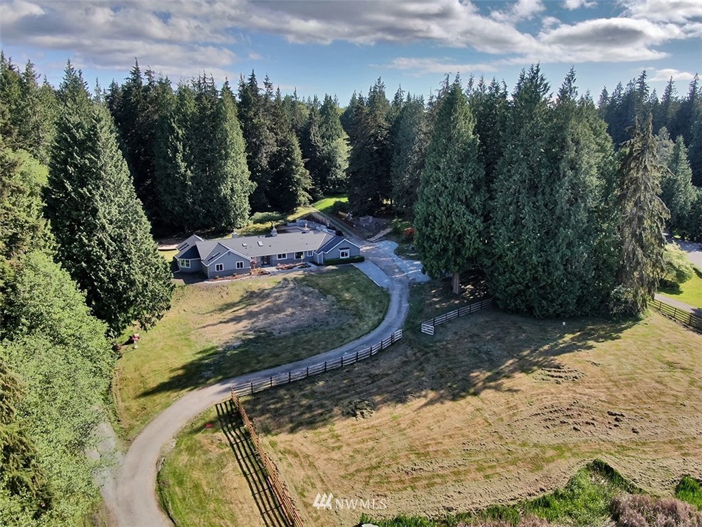 971 Sandy Point Road Langley, WA 98260 - Photo 3 of 25 a view of a swimming pool with a yard