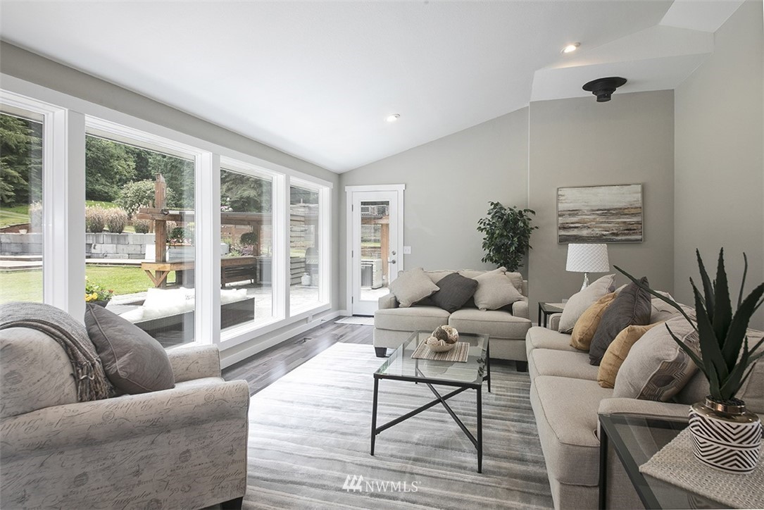 971 Sandy Point Road Langley, WA 98260 - Photo 9 of 25 a living room with furniture and a large window
