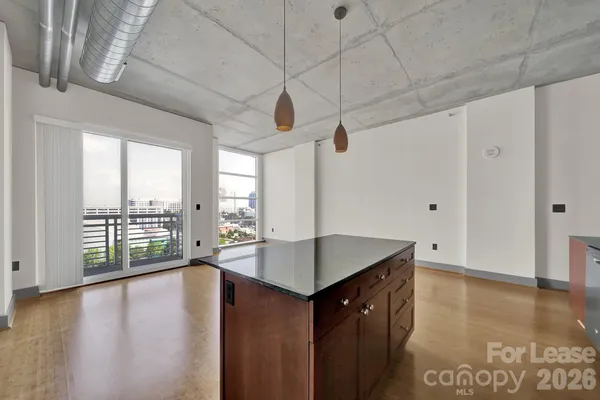 a kitchen with stainless steel appliances a refrigerator and a stove top oven