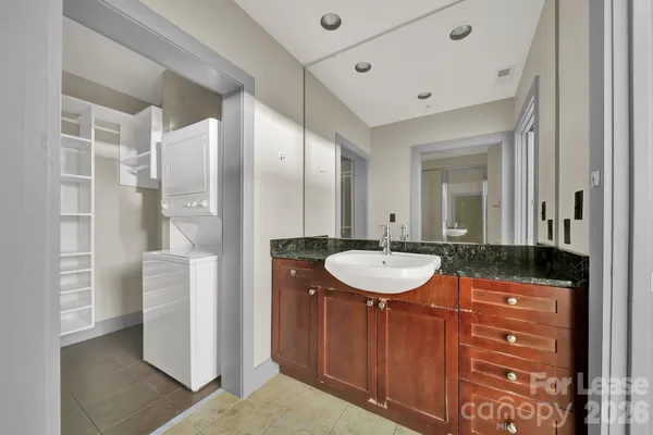 a bathroom with a shower a toilet and sink