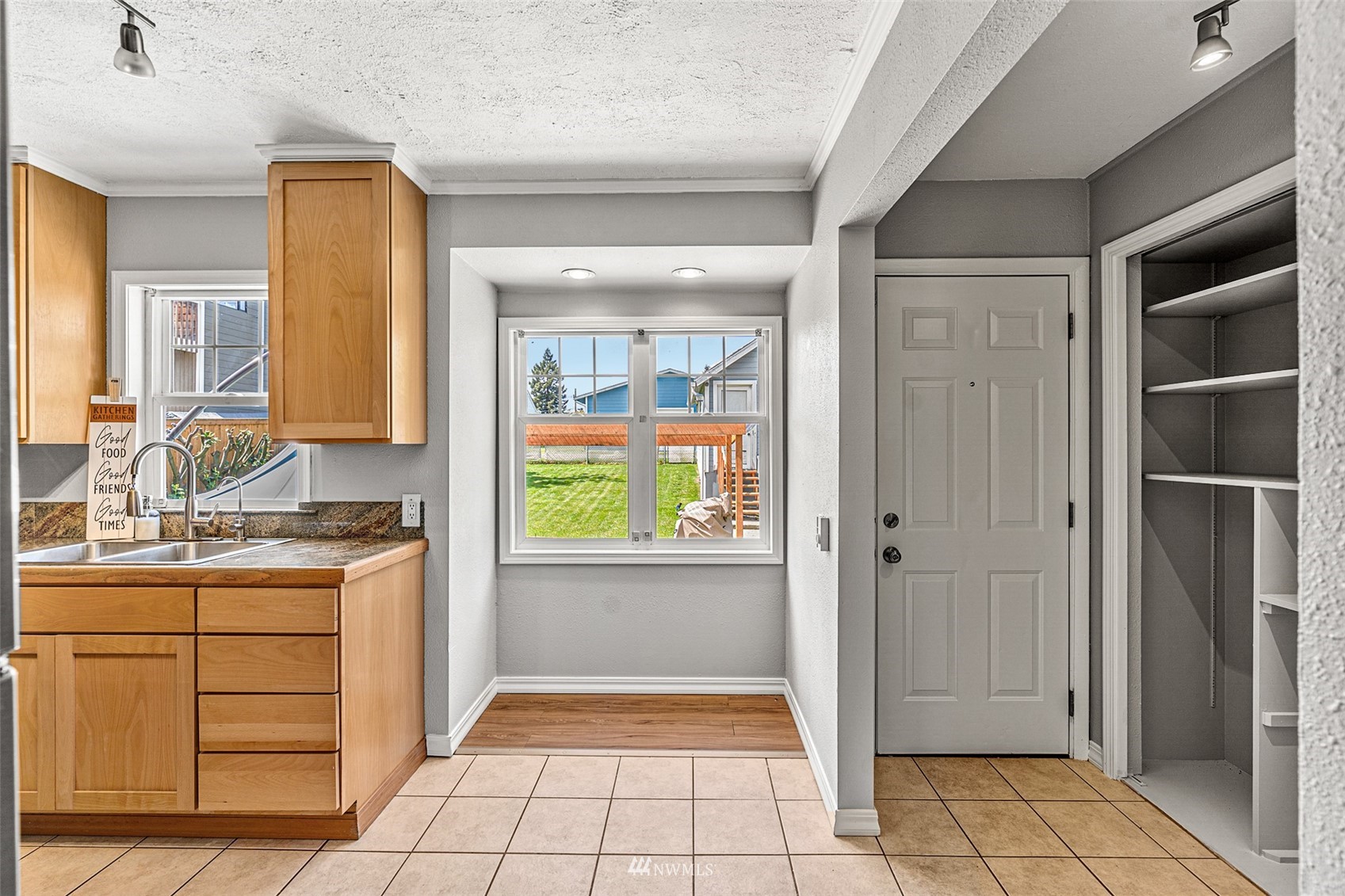 1818 Maple Street Everett, WA 98201 - Photo 11 of 37 a bathroom with a granite countertop sink a toilet and a vanity