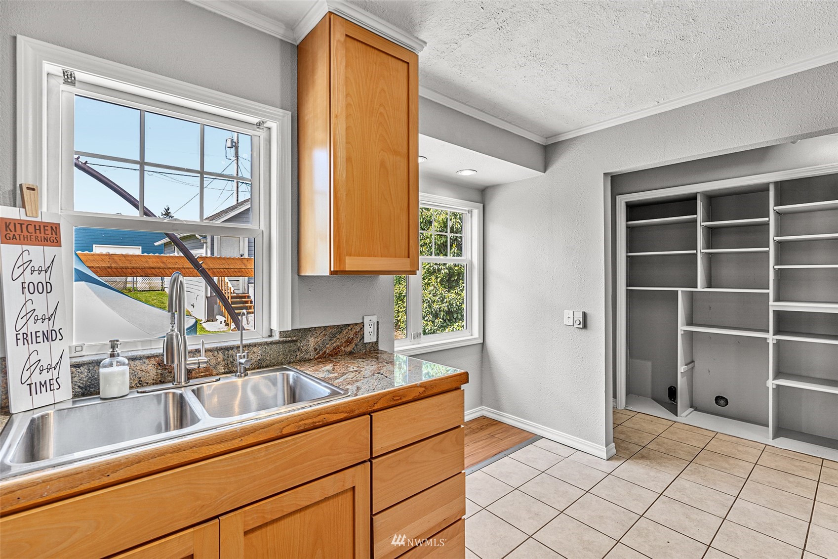 1818 Maple Street Everett, WA 98201 - Photo 15 of 37 a kitchen with a sink and cabinets