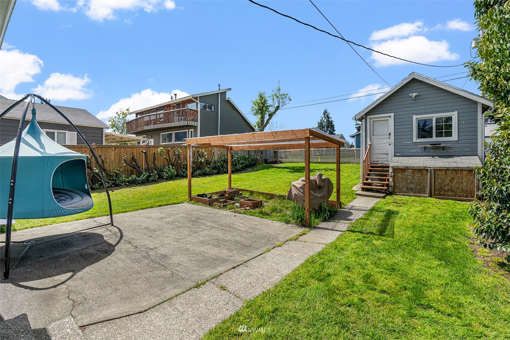 1818 Maple Street Everett, WA 98201 - Photo 18 of 37 a view of a house with backyard and porch