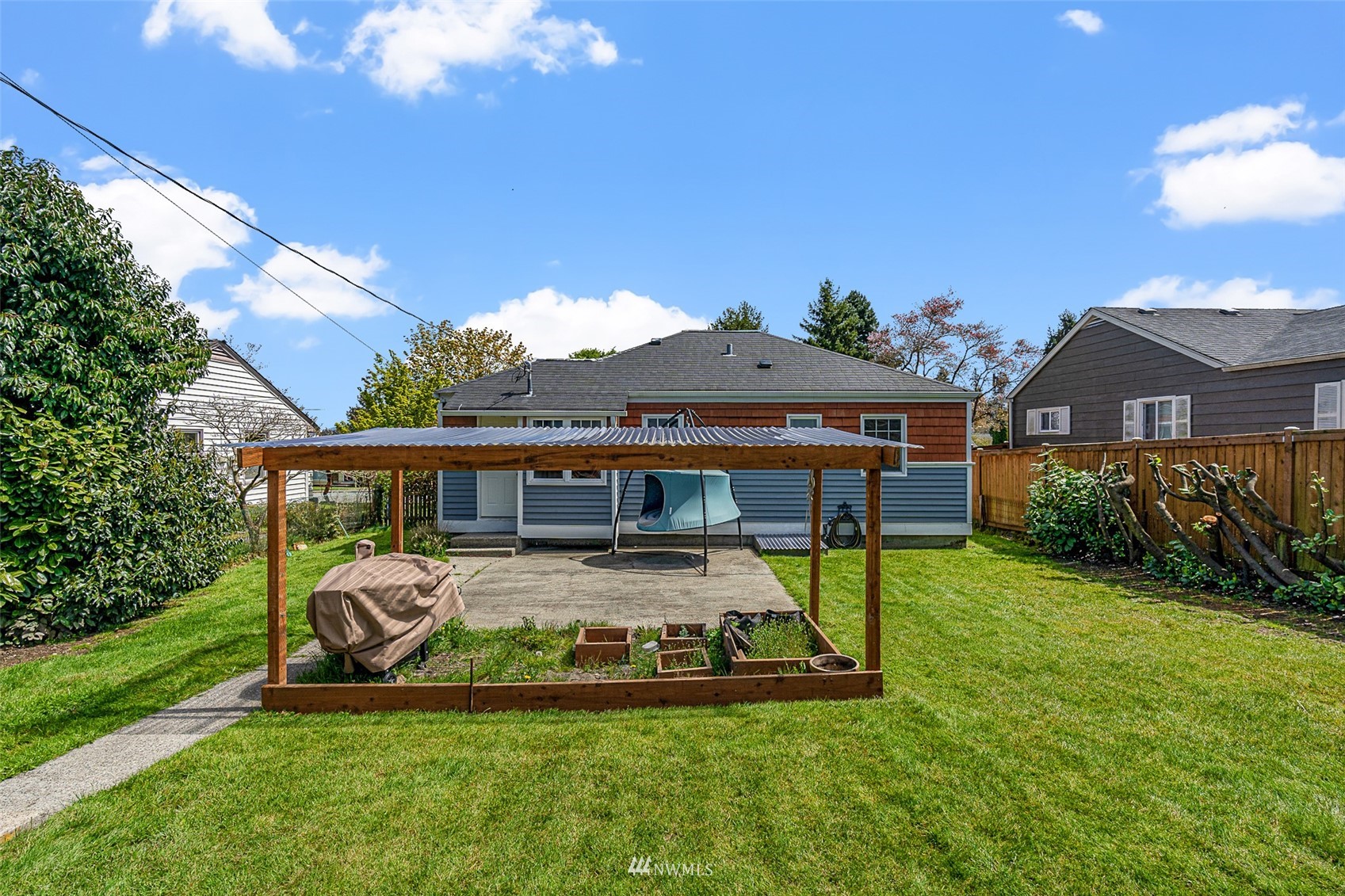 1818 Maple Street Everett, WA 98201 - Photo 22 of 37 a view of a house with backyard porch and sitting area