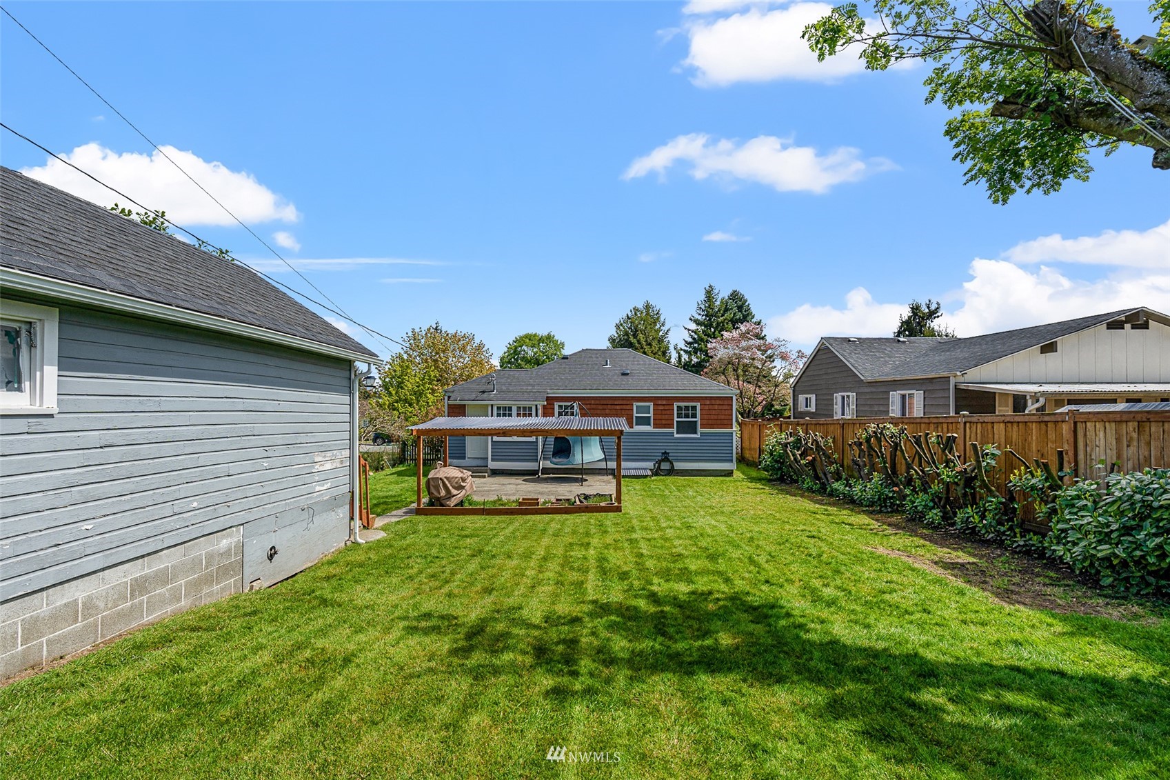 1818 Maple Street Everett, WA 98201 - Photo 24 of 37 a view of a house with a yard porch and sitting area