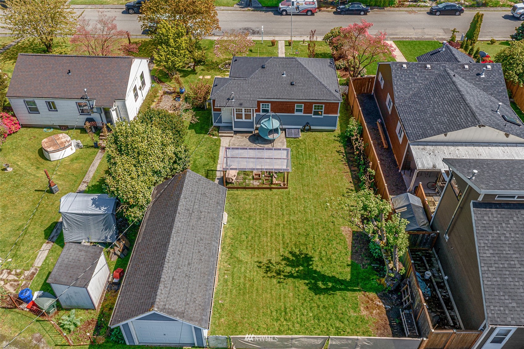 1818 Maple Street Everett, WA 98201 - Photo 25 of 37 an aerial view of a house with garden space and a patio