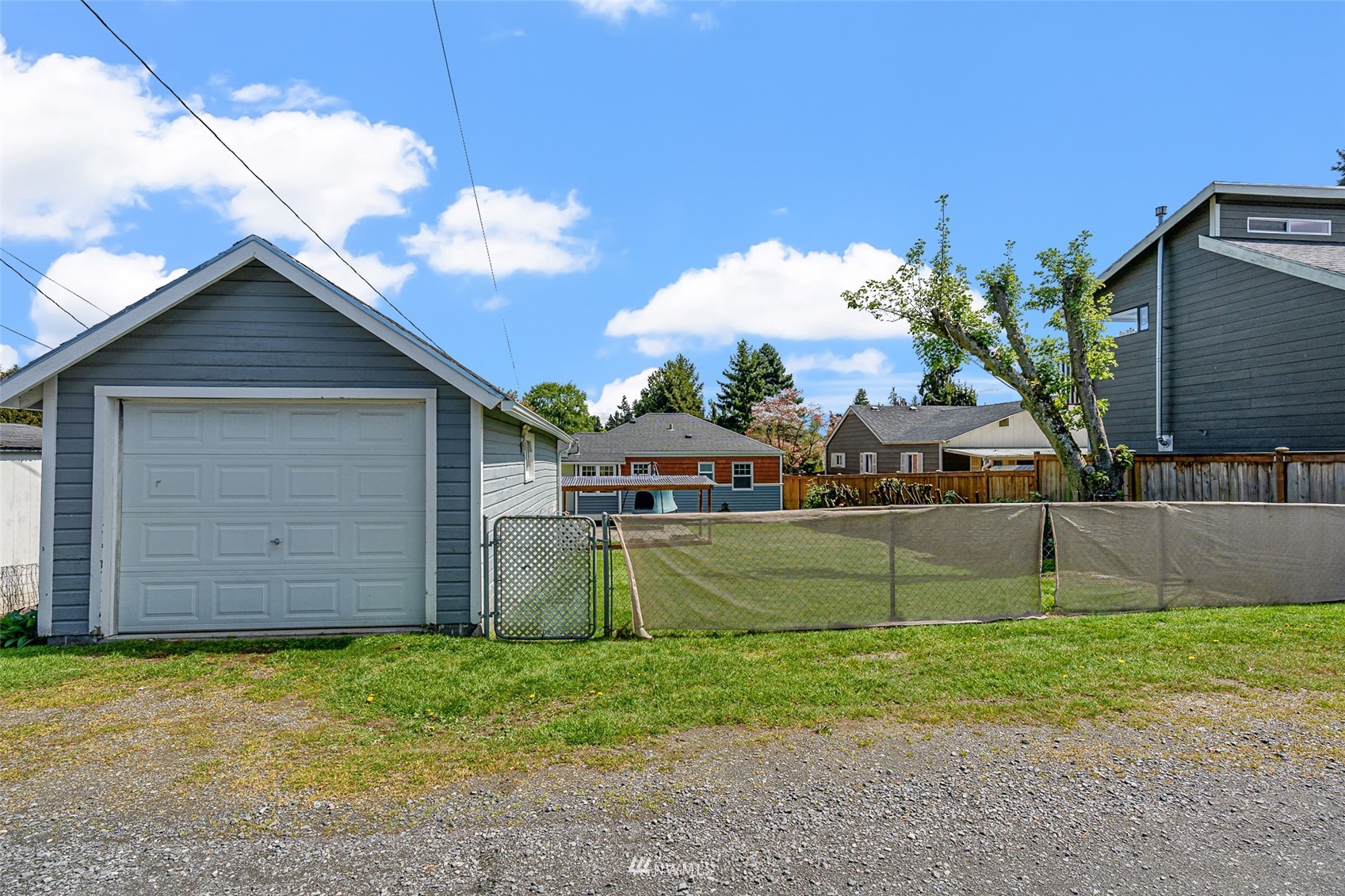 1818 Maple Street Everett, WA 98201 - Photo 26 of 37 a front view of a house with a garden