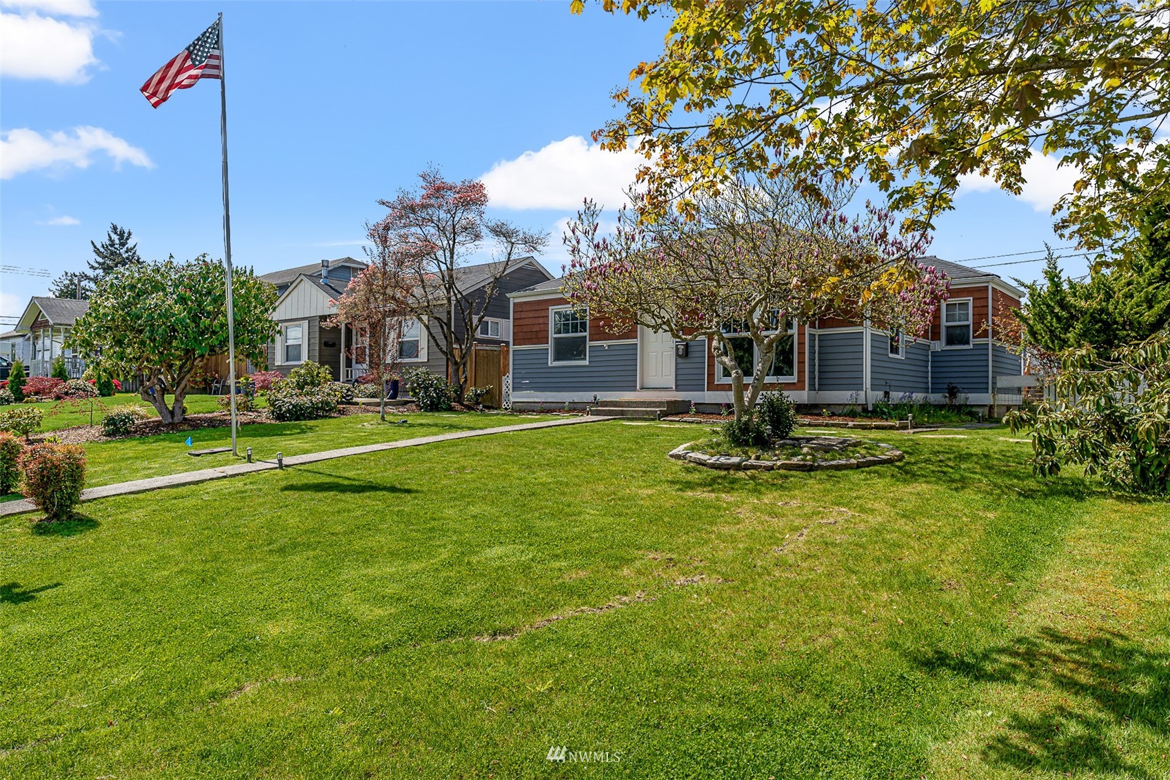 1818 Maple Street Everett, WA 98201 - Photo 35 of 37 a view of a house with a big yard and palm trees