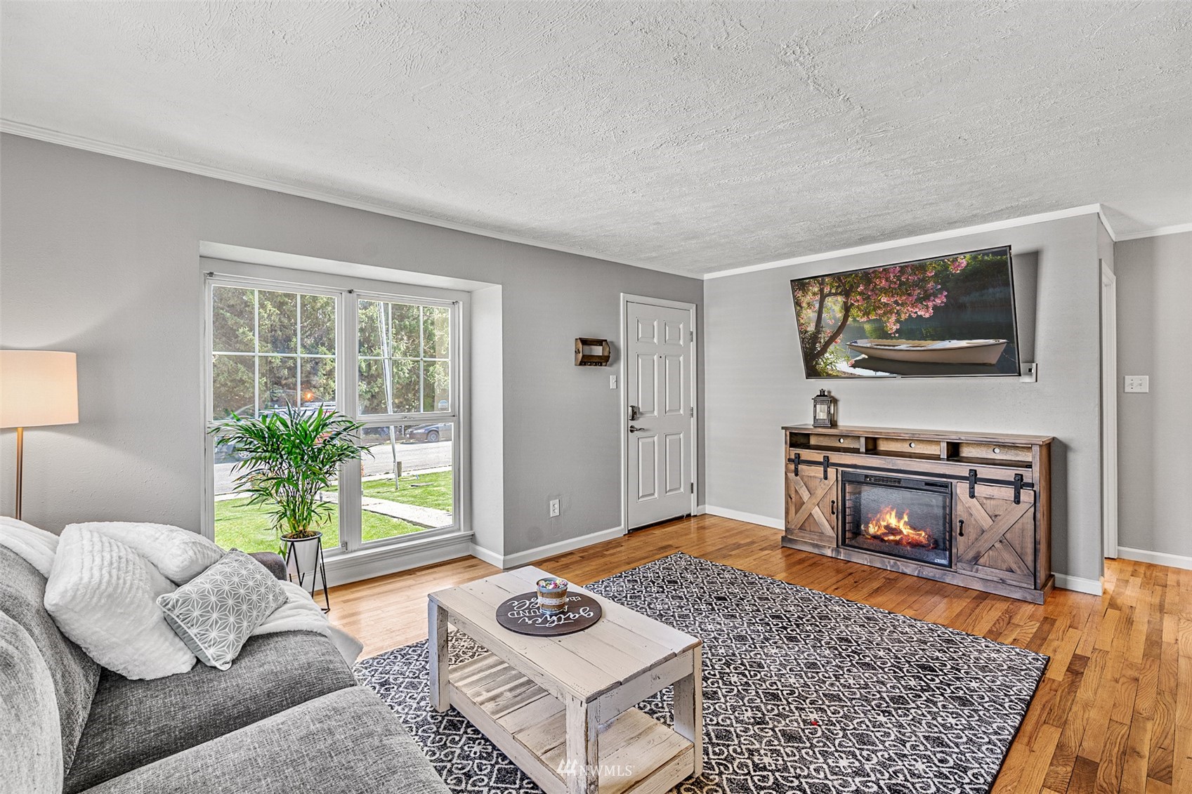 1818 Maple Street Everett, WA 98201 - Photo 7 of 37 a living room with furniture and a fireplace