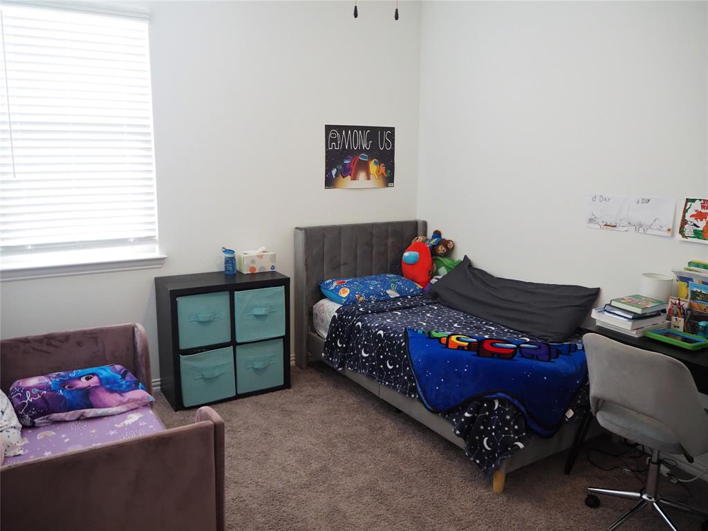 1116 Mesquite Lane Princeton, TX 75407 - Photo 23 of 28 a bedroom with a bed dresser and window