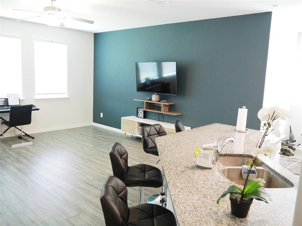 1116 Mesquite Lane Princeton, TX 75407 - Photo 10 of 28 a bedroom with furniture and a flat screen tv