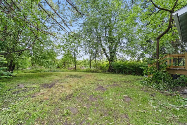 a view of outdoor space with deck and yard