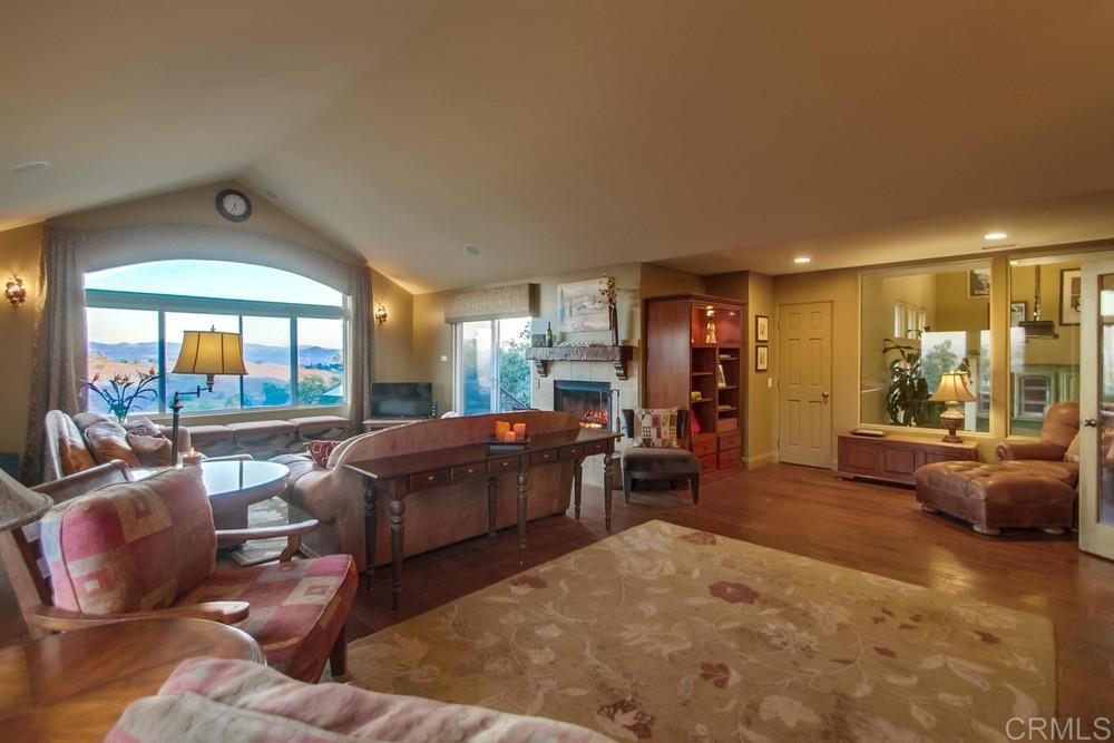 670 Georgine Road Fallbrook, CA 92028 - Photo 9 of 25 Views from every window in your massive family room with cozy fireplace and wine room