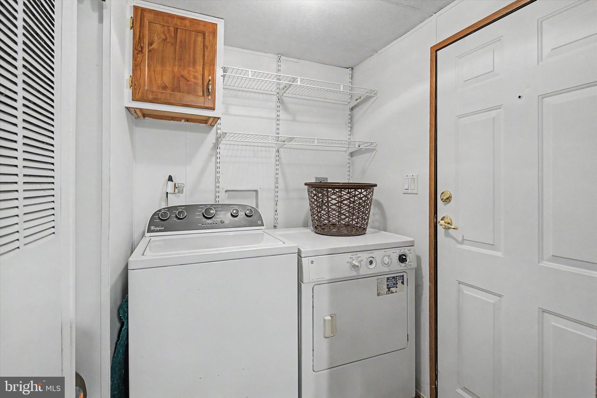 16 Ray Drive Denver, PA 17517 - Photo 17 of 20 a view of storage and utility room with washer and dryer