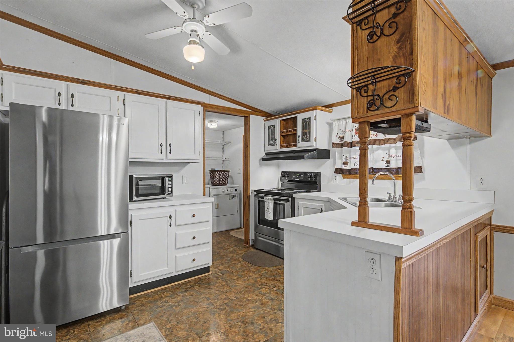 16 Ray Drive Denver, PA 17517 - Photo 6 of 20 a kitchen with stainless steel appliances granite countertop a refrigerator a stove and a sink with cabinets