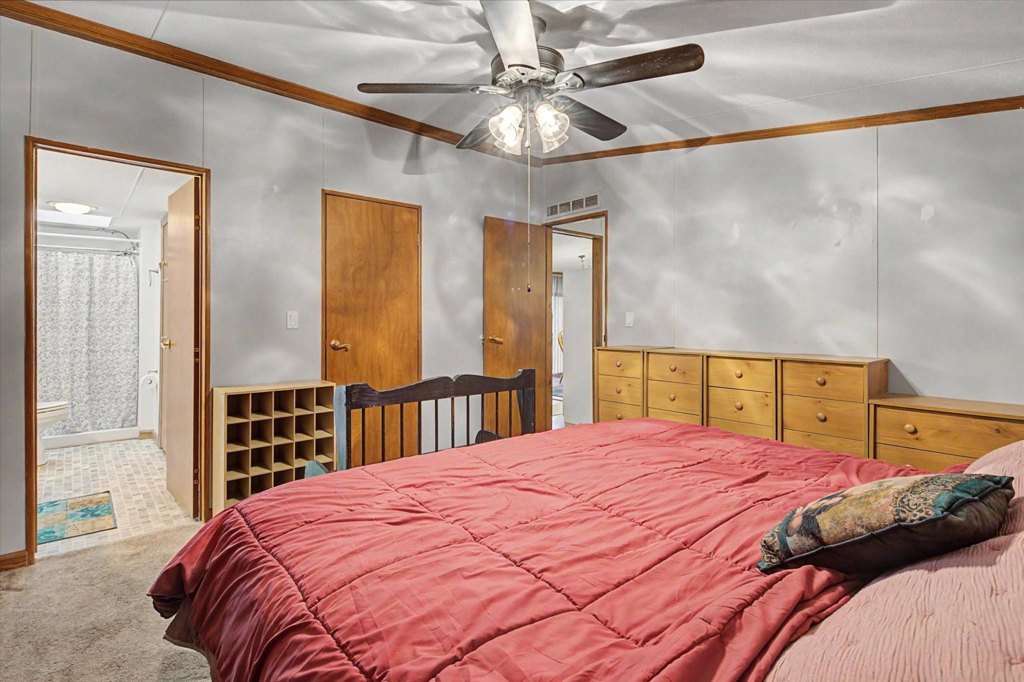 16 Ray Drive Denver, PA 17517 - Photo 10 of 20 a bedroom with a large bed and a chandelier