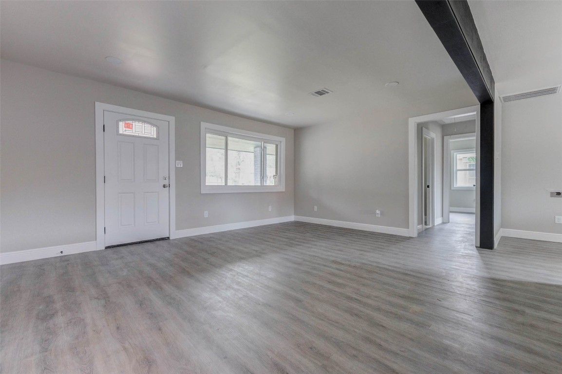 511 Wagers Street Conroe, TX 77301 - Photo 18 of 39 an empty room with wooden floor and windows