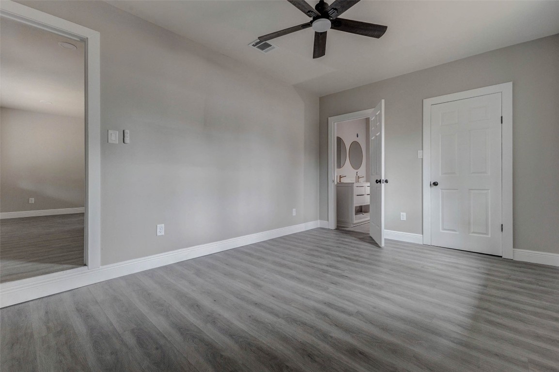 511 Wagers Street Conroe, TX 77301 - Photo 20 of 39 wooden floor in an empty room with a window