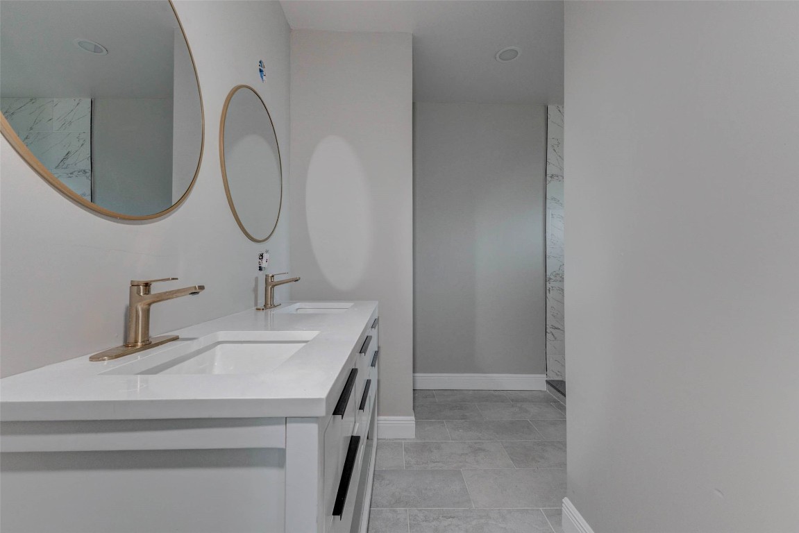 511 Wagers Street Conroe, TX 77301 - Photo 22 of 39 a bathroom with a sink and a mirror