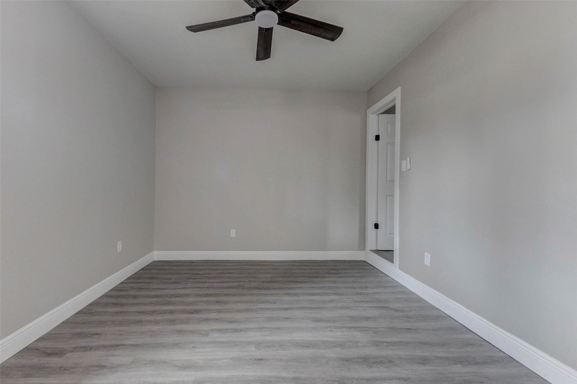 511 Wagers Street Conroe, TX 77301 - Photo 24 of 39 a view of an empty room with wooden floor