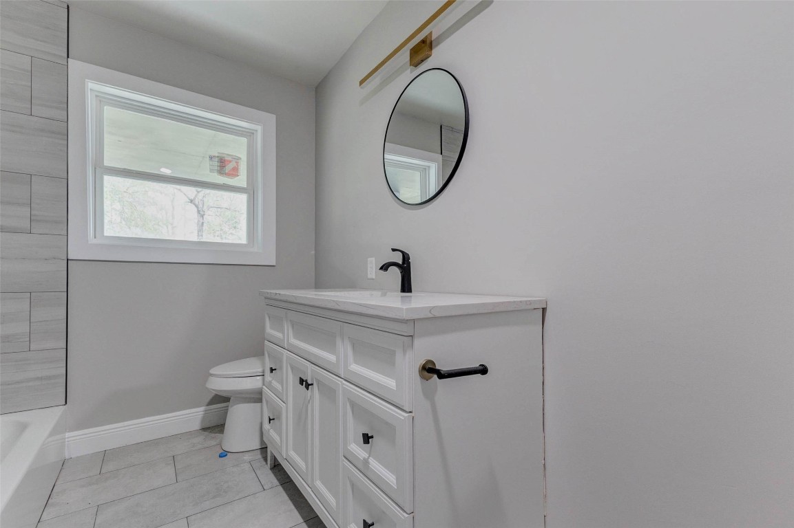 511 Wagers Street Conroe, TX 77301 - Photo 25 of 39 a bathroom with a sink and mirror