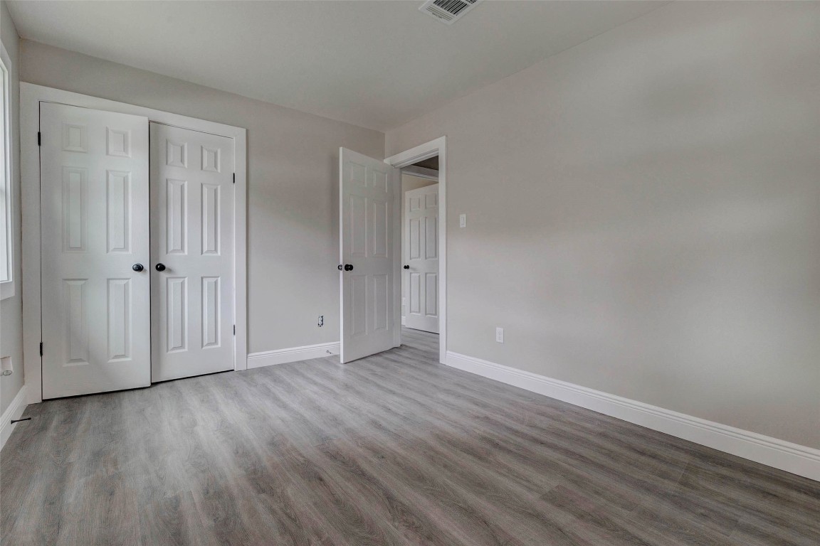 511 Wagers Street Conroe, TX 77301 - Photo 29 of 39 a view of an empty room with wooden floor