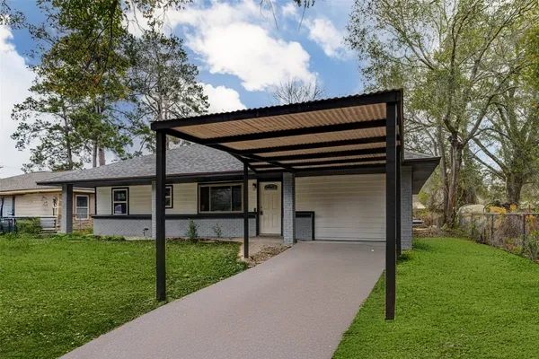 a house view with a garden space