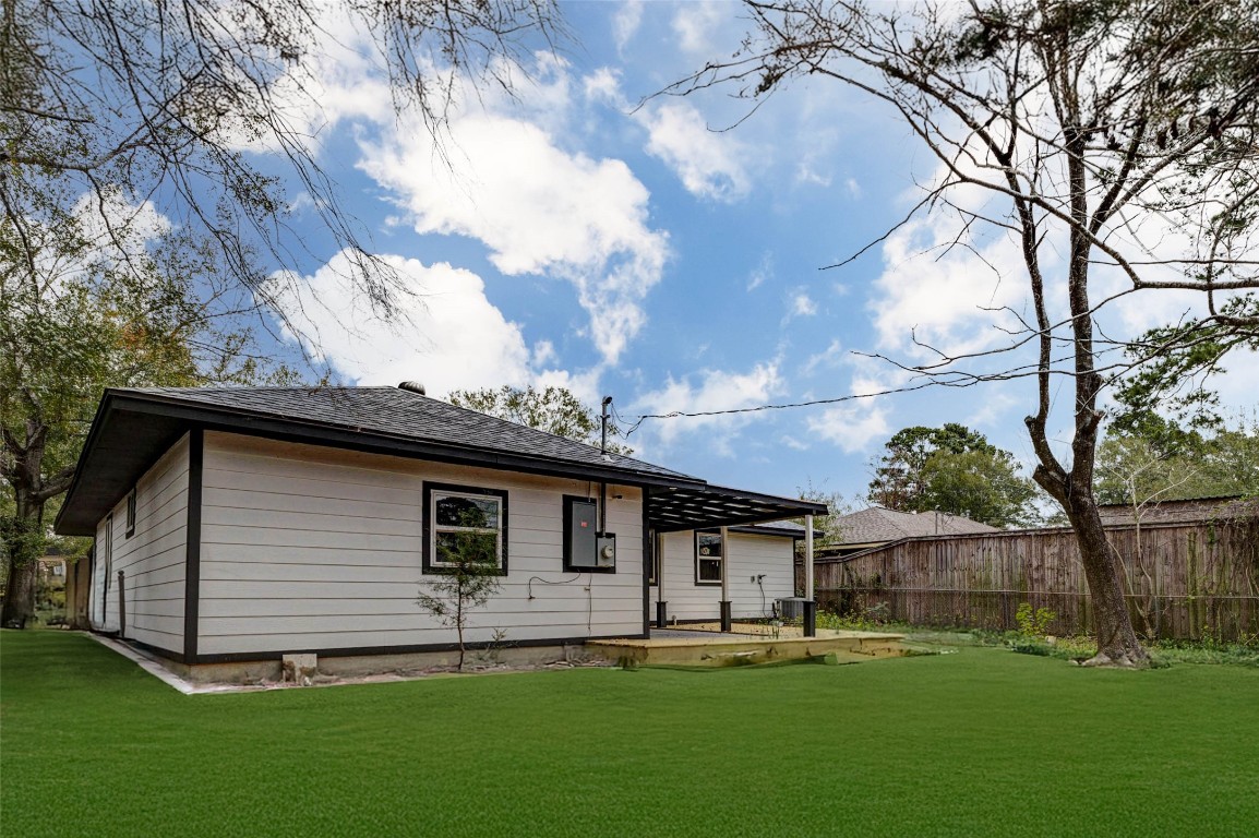 511 Wagers Street Conroe, TX 77301 - Photo 34 of 39 a view of a house with a yard