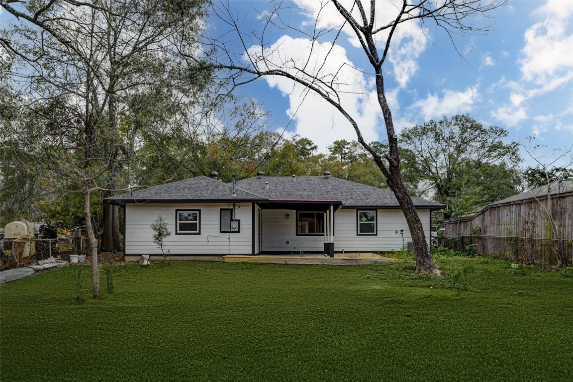 511 Wagers Street Conroe, TX 77301 - Photo 36 of 39 a front view of house with yard and green space