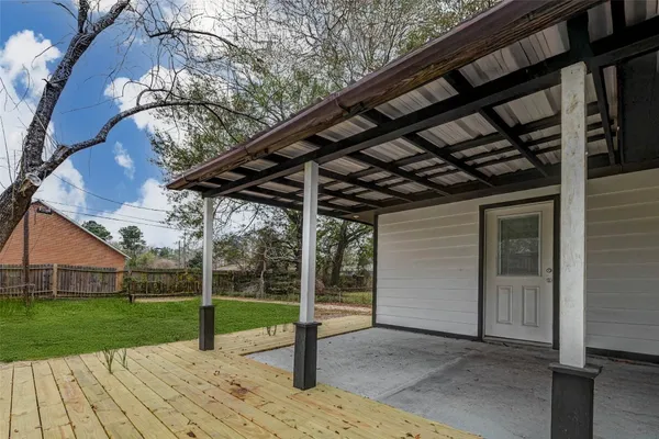 a view of a backyard with wooden floor