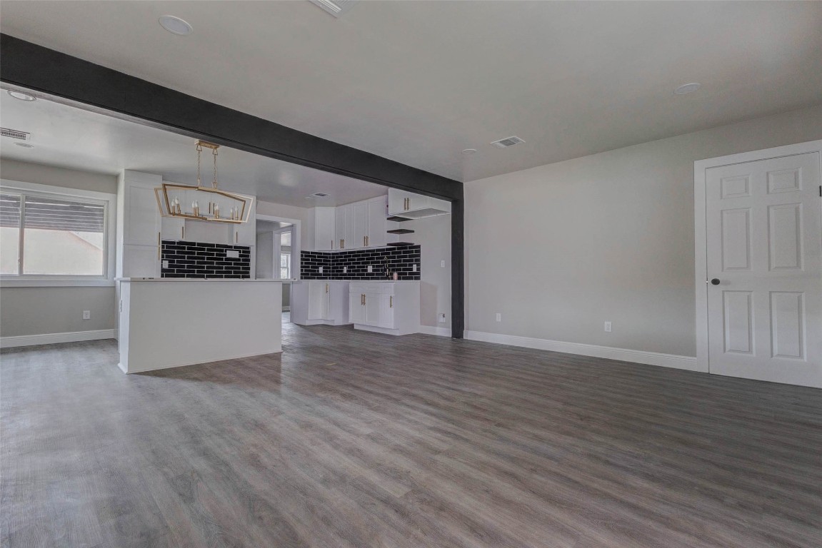 511 Wagers Street Conroe, TX 77301 - Photo 6 of 39 a view of a kitchen with wooden floor and electronic appliances
