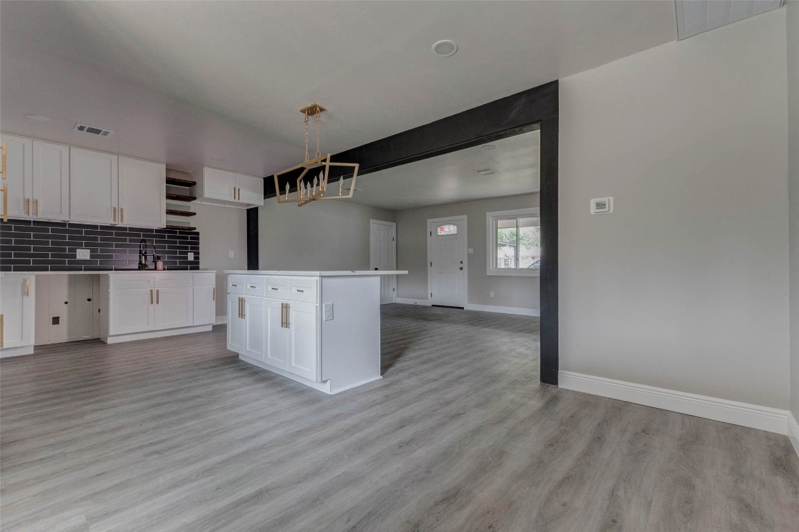 511 Wagers Street Conroe, TX 77301 - Photo 9 of 39 a view of a kitchen with wooden floor
