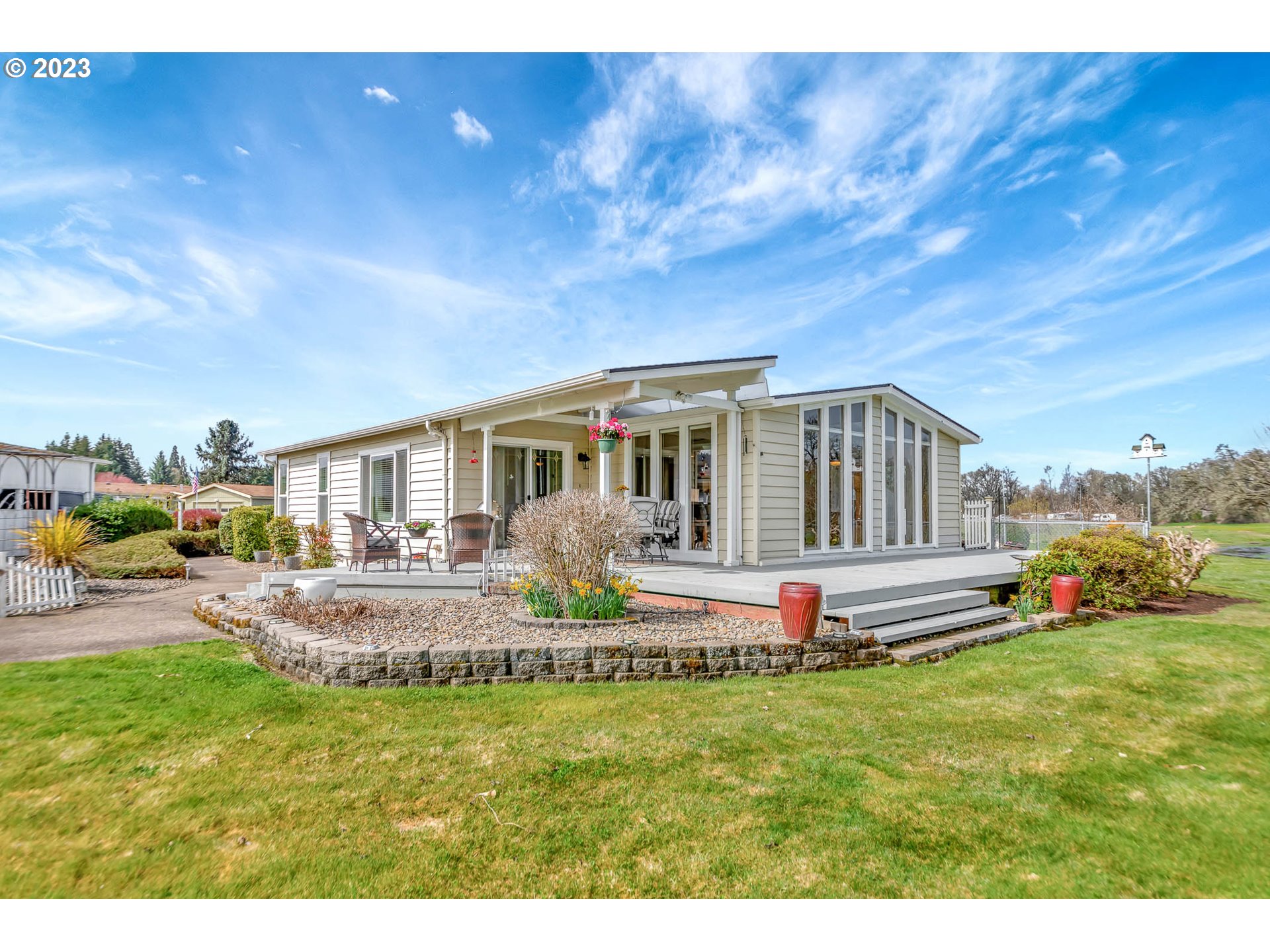 85721 Hampstead Lane Eugene, OR 97405 - Photo 11 of 45 a front view of house with outdoor seating and barbeque oven
