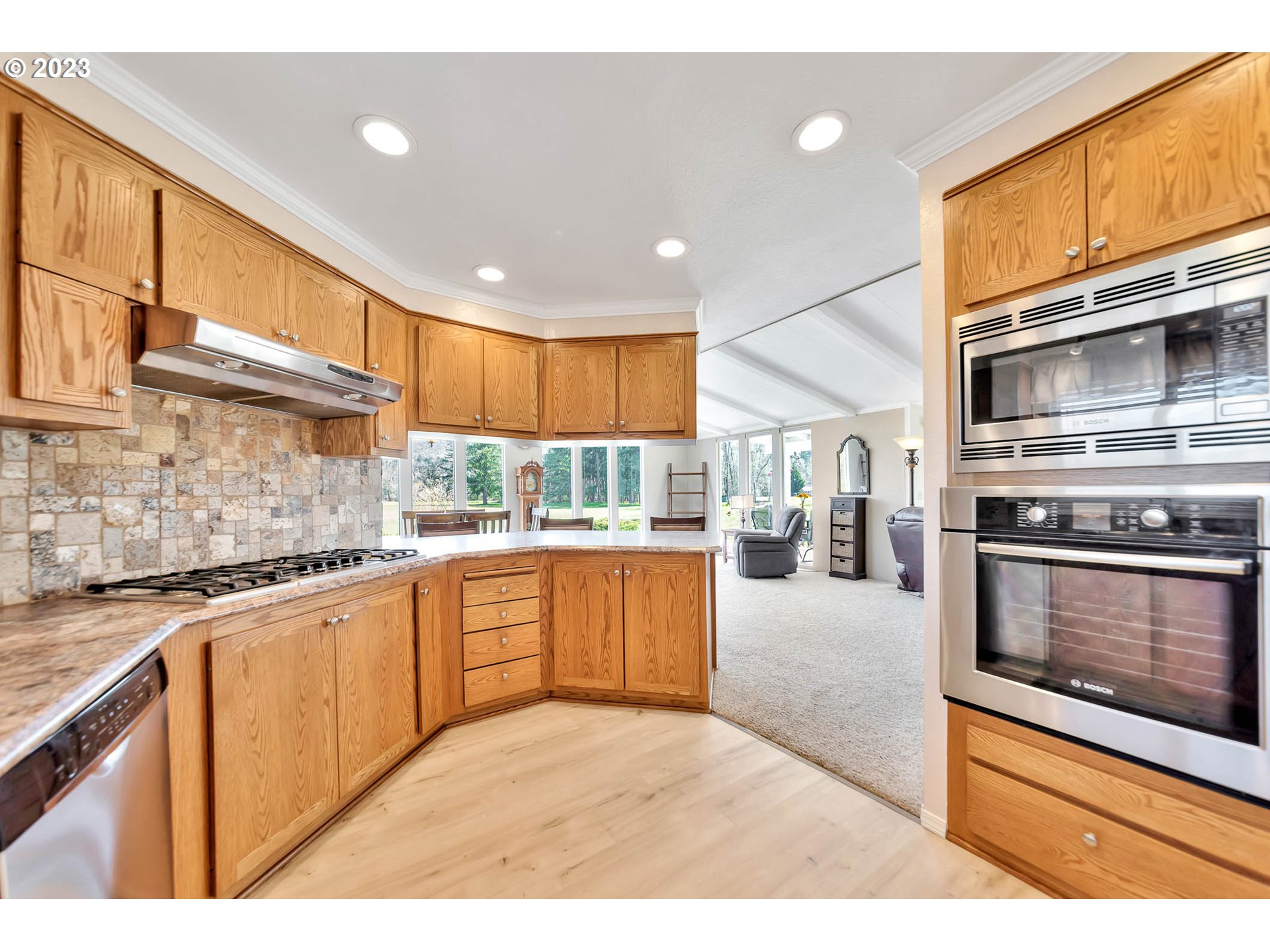 85721 Hampstead Lane Eugene, OR 97405 - Photo 17 of 45 a kitchen with stainless steel appliances granite countertop a stove a sink and a microwave