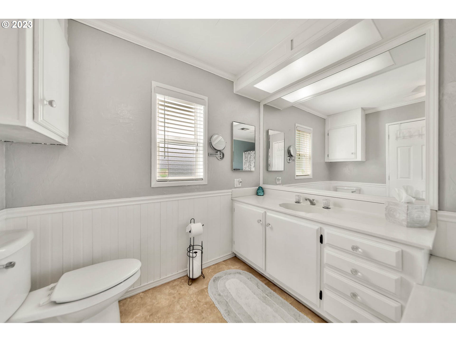 85721 Hampstead Lane Eugene, OR 97405 - Photo 28 of 45 a bathroom with a granite countertop toilet sink and mirror