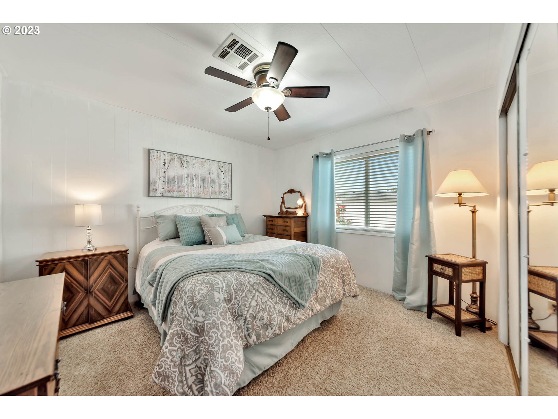 85721 Hampstead Lane Eugene, OR 97405 - Photo 31 of 45 a bed room with a bed and a chandelier