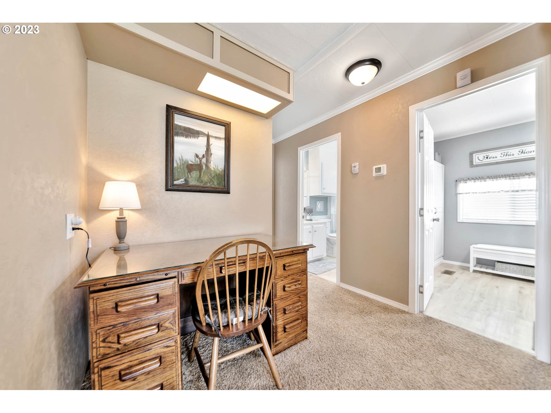 85721 Hampstead Lane Eugene, OR 97405 - Photo 33 of 45 a view of a hallway to a livingroom with furniture