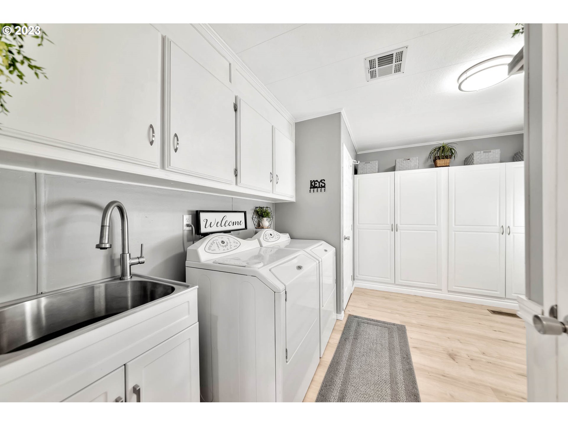 85721 Hampstead Lane Eugene, OR 97405 - Photo 10 of 45 a kitchen with stainless steel appliances granite countertop a sink a stove and a refrigerator with wooden cabinets
