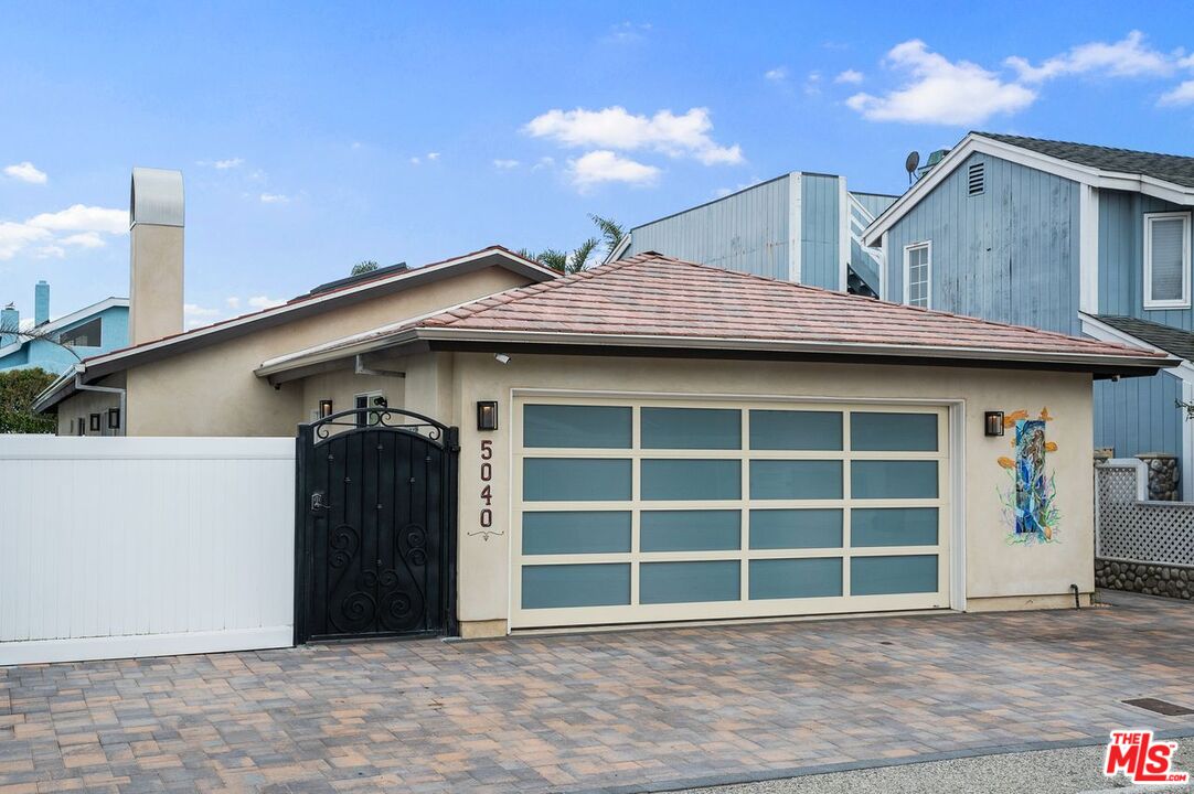 5040 Terramar Way Oxnard, CA 93035 - Photo 13 of 16 a view of a house with a garage and balcony
