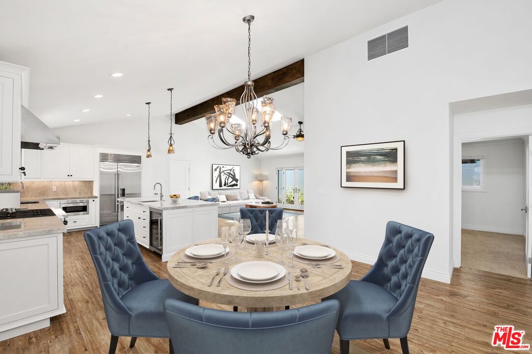 5040 Terramar Way Oxnard, CA 93035 - Photo 2 of 16 a dining room with furniture a rug and wooden floor